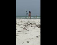 Girl black cap bikini sexy pose tripod