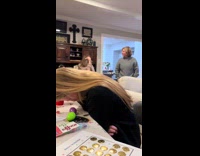 Family holding their laugh at grampas long prayer