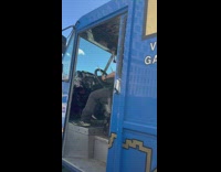 Guy in food truck drums on steering wheel