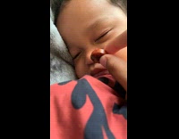 Baby sleeping wakes up to eat sausage falls asleep