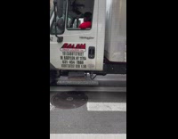 Street performer plays the trombone 