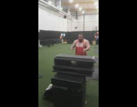 Gym guy red shirt jumps on stacking blocks and falls on the ground 