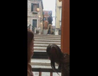 Two guys hold up girl for photo