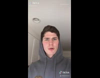 Grey sweater guy red hot dog cooker 