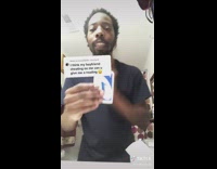 Guy pretends to read Uno cards