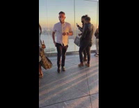 People take photo golden hour nyc building