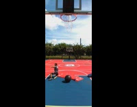 Man on a yoga ball kicks ball to shoot to the other court