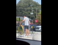 Man films with hula-hoop at the park