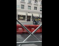 Guy driving rick shaw in circle in middle of road 