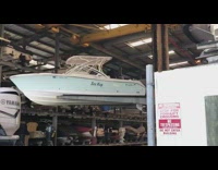 Crane picks up boat puts on shelf