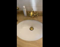 Person slaps faucet that makes ringing sound