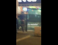 Guy kicks temporary fence in street 