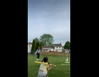 Girl playing softball hit in forehead with ball 