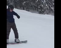 Snowboarder Purple Jacket Falls Backwards on Hill