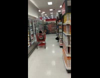 Girl sits in cart in market for photo