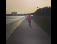 Collab Kook Of The Day - Guy rollerblading down the street in blue and pink windbreaker jacket