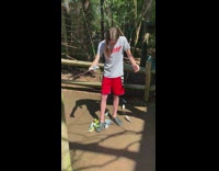 Parakeets flock over crocs of long haired guy