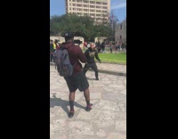 man white head phones jumping old building