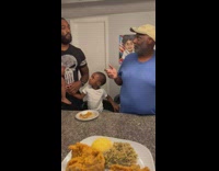 Lady Passes Plate Full of Food to Men