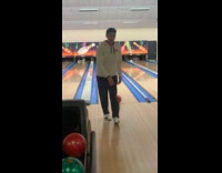 Man kick bowling ball roll to gutter fail