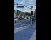Young girl pull leg behind middle street