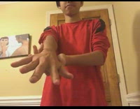 Red shirt guy rotates arm 360 degrees 