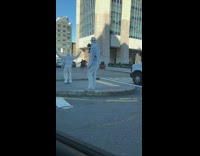 Two guys hazmat suit spin corona virus