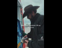 Guy fills up his truck 