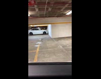 Collab DailyDoseOfInternet - Parked white car touches wall parking structure 
