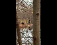 Guy plays theremin electronic instrument at park 