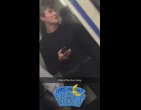 man in black sweater carrying food in plastic bag