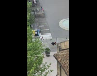 Woman black dress bend over pose park