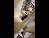 Guy in black shirt falls on stairs