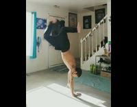 Guy does handstand spins around on hands
