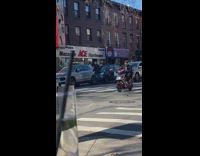Man riding red scooter sings uptown girl loudly