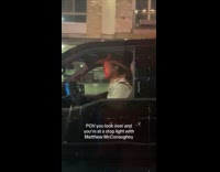 Two women in traffic beside Matthew McConaughey