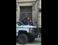 Police men force open gate of the building in NY 