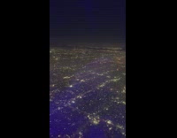 City lights and fireworks plane view night