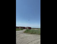 Jet plane flies over soldiers in uniform 