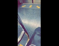 Woman with blue hair wig sits next to boy with white cube head on subway train