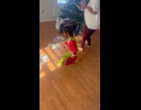 Kid reacts to fake Snow by Santa