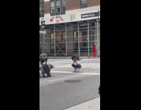 Woman large hat squat pose on road
