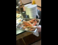 Friends fights for the crab legs inside the restaurant
