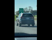 Car drives on highway with wiggly bumper