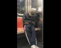 Man has something in the crotch of his pants and sleeps on subway train