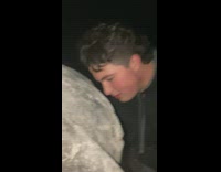 Guys light up small fire and puts in tire before rolling it down hill