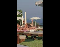 Woman bikini photo shoot wood fence umbrellas