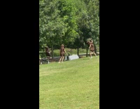 Girls in poop emoji costume dance park part 1