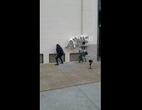 two girls silver balloons white wall