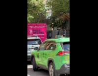 Guy ride unicycle hold bouquets each hand
